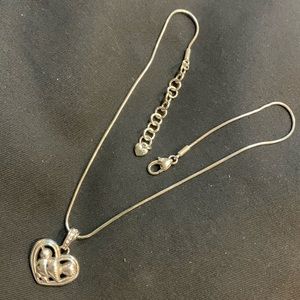 Brighton silver necklace. 16 inch long chain. Dove and heart design